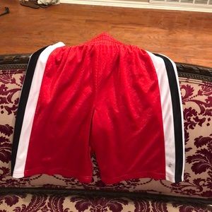 Black red and white oasics  shorts boys medium